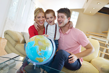 Image showing family have fun with globe