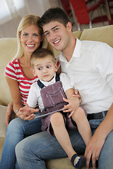 Image showing family at home using tablet computer