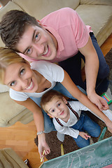 Image showing family drawing on school board at home