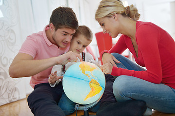 Image showing family have fun with globe