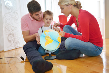 Image showing family have fun with globe