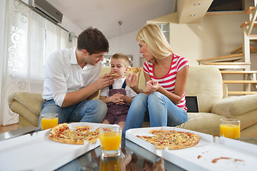 Image showing family eating pizza