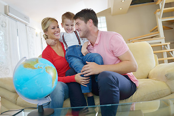 Image showing family have fun with globe