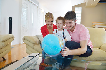 Image showing family have fun with globe