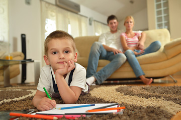 Image showing family drawing on school board at home