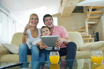 Image showing family at home using tablet computer