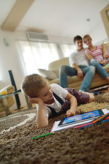 Image showing family at home using tablet computer