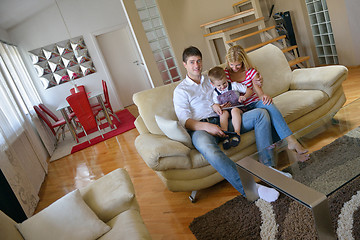 Image showing family at home using tablet computer