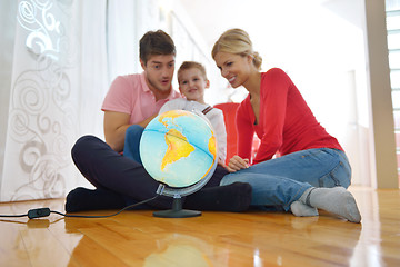 Image showing family have fun with globe