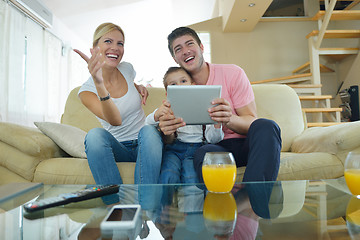 Image showing family at home using tablet computer