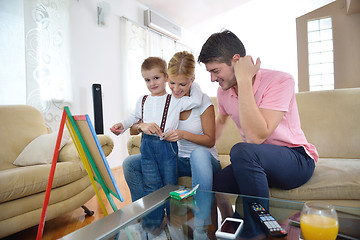 Image showing family drawing on school board at home