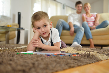 Image showing family drawing on school board at home