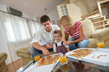 Image showing family eating pizza