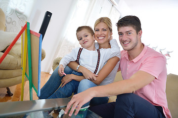 Image showing family drawing on school board at home