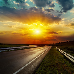 Image showing dramatic sunset over asphalt road