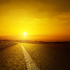 Image showing asphalt road and orange sunset