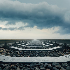 Image showing railroad closeup goes to horizon in dramatic sky