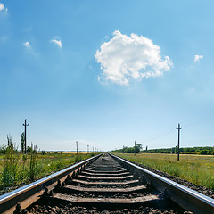 Image showing cloud in blue sky over railroad