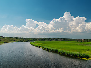 Image showing white clouds over river