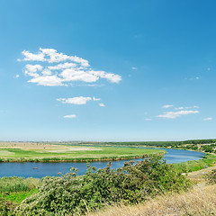 Image showing river in green grass and blue sky