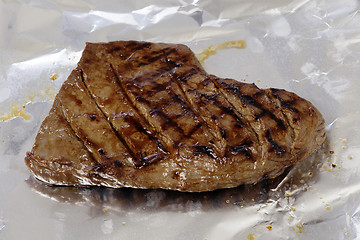 Image showing Grilled flank steak resting