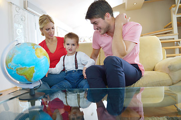 Image showing family have fun with globe