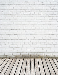 Image showing white brick wall and wooden floor