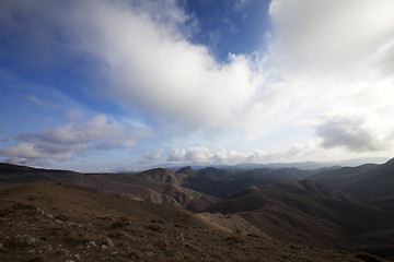 Image showing Mountains and blue sky with clouds