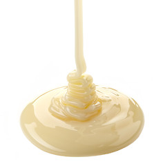 Image showing pouring condensed milk on a white background