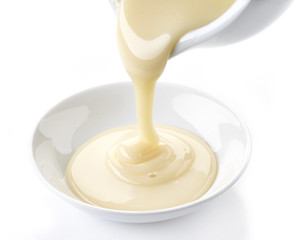 Image showing pouring condensed milk with sugar in a bowl