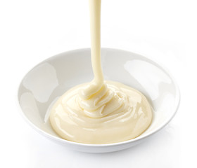 Image showing pouring condensed milk with sugar in a bowl