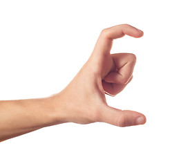 Image showing One human hand with two fingers keeping something