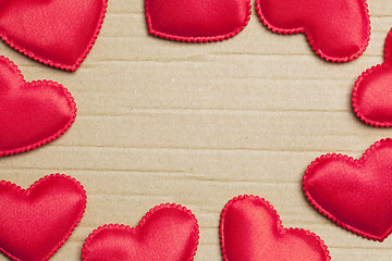 Image showing red hearts on vintage  paper background