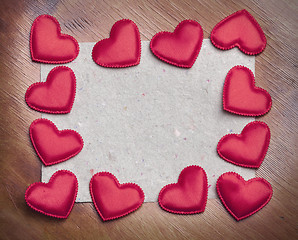 Image showing red hearts on vintage  paper background