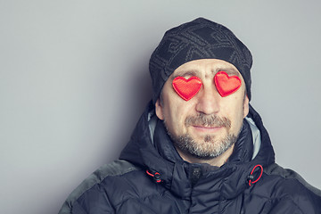 Image showing Portrait of a man with hearts in her eyes