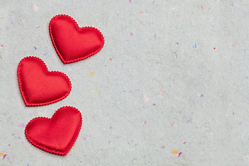 Image showing red hearts on vintage  paper background