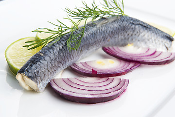 Image showing Fillet herring with onion and lemon