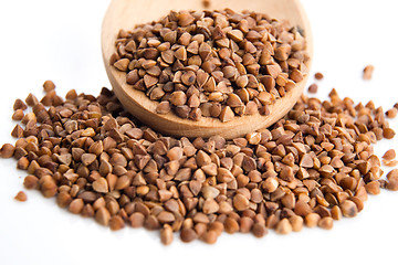 Image showing Buckwheat seeds on wooden spoon in closeup 