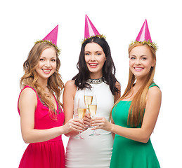 Image showing three women in pink hats with champagne glasses