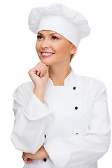 Image showing smiling female chef dreaming