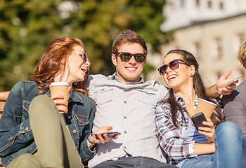 Image showing group of students or teenagers with smartphones