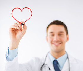 Image showing male doctor drawing heart in the air