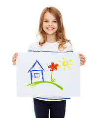 Image showing smiling little child holding picture of house