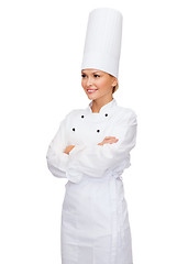 Image showing smiling female chef with crossed arms