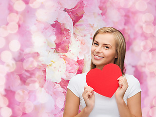 Image showing smiling woman in white t-shirt with heart