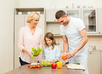 Image showing happy family making dinner in kitchen