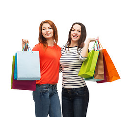 Image showing two smiling teenage girls with shopping bags