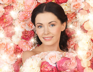 Image showing woman with background full of roses