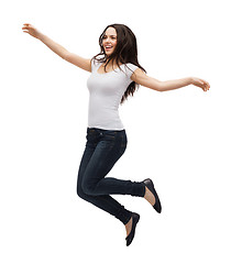 Image showing teenage girl in white blank t-shirt jumping