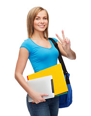 Image showing female student with bag, tablet pc and folders